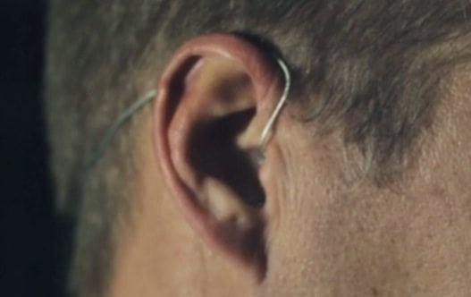 Close-up of ear with earpiece